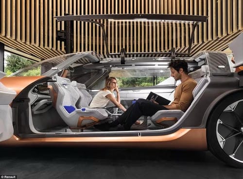 A futuristic, open-concept vehicle with swivel seats, where two passengers interact comfortably, simulating a living space.