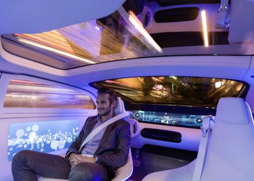  A man relaxing in a high-tech, ambient-lit vehicle interior, with motion-blurred city lights visible through the windows.