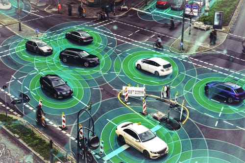A street view overlaid with green sensor rings around each car, visualizing the LiDAR and radar detection systems used by self-driving cars to perceive their surroundings.